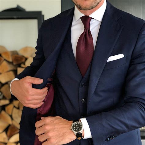 burgundy tie navy suit.